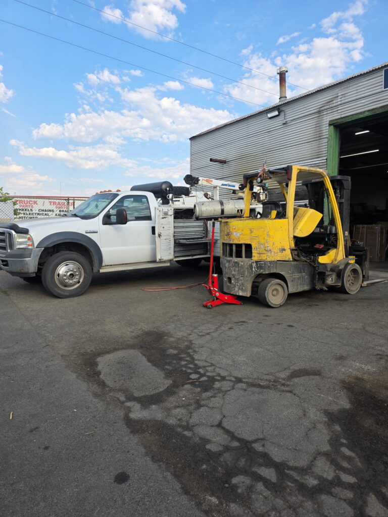 Hyster S120FT-BCS forklift PM service in Spokane with the Starkenburg Enterprises mobile service truck alongside