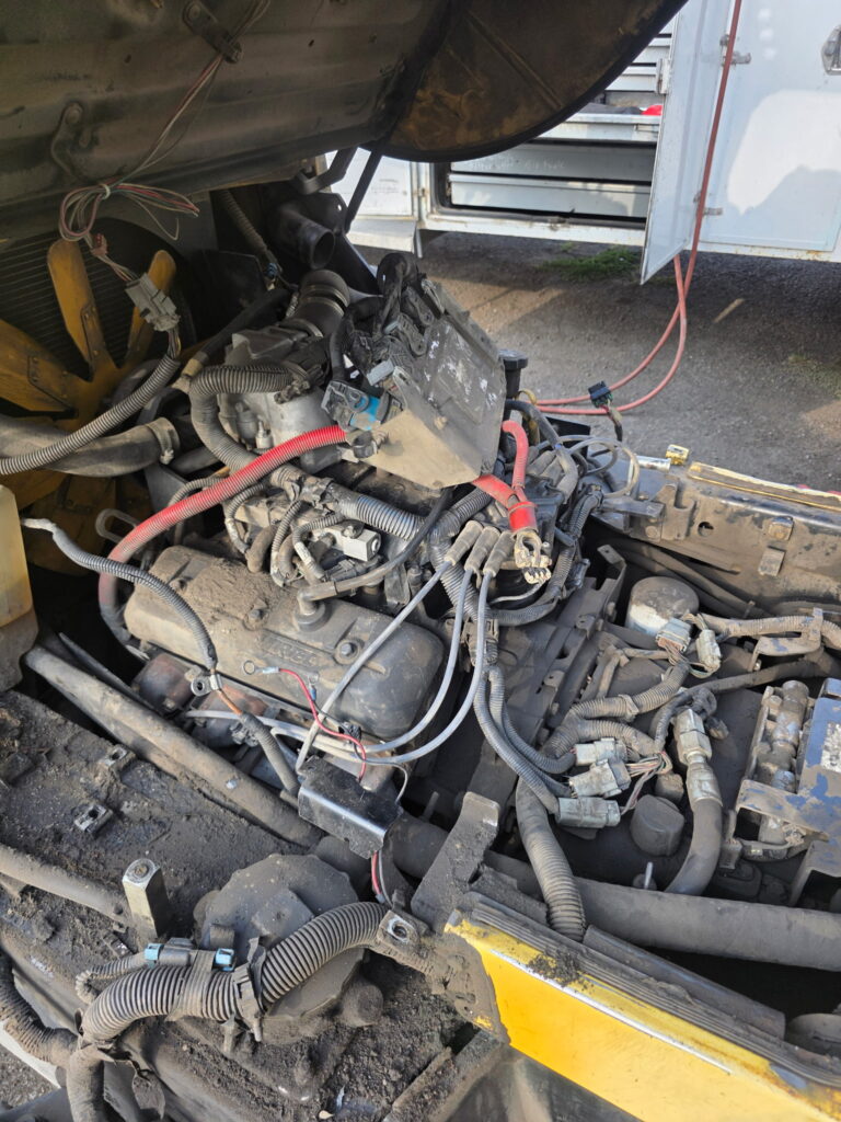 Dust packed engine compartment on a neglected Hyster S120FT-BCS forklift before service